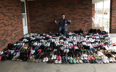 Rogers Scholar Walker Campbell of Casey County collects 400 new or gently used shoes for students