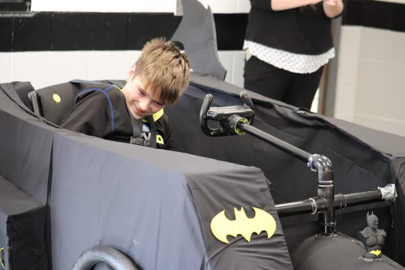 2022 Rogers Scholar Kendyll Hall builds adaptive bat mobile costume for student