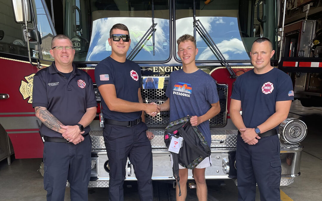 2022 Rogers Scholar Camden Tackett donates backpacks to firefighters